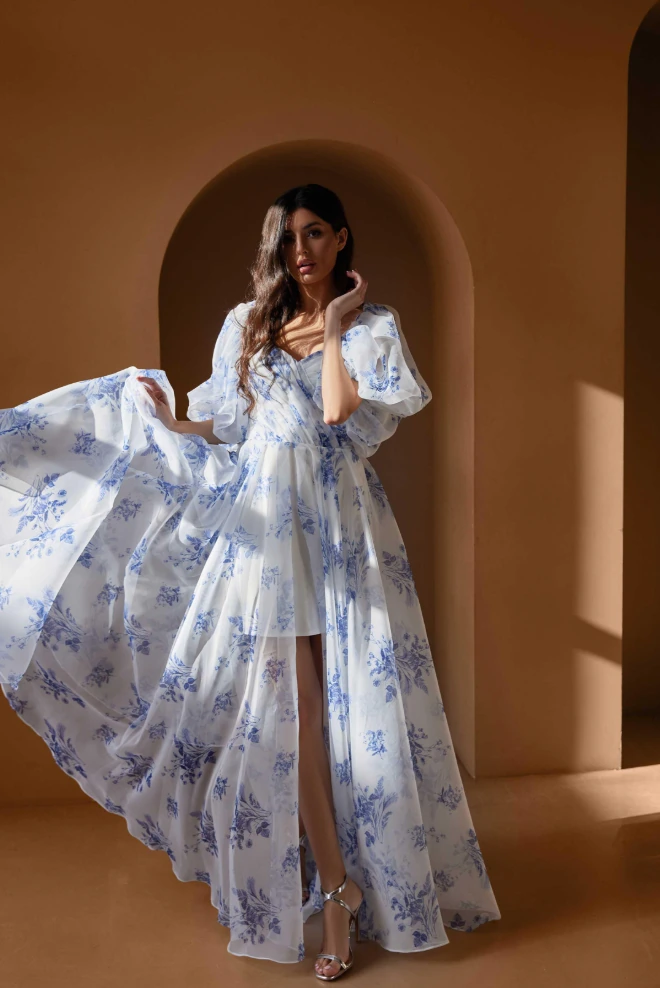 Floral chiffon gowns show puff sleeves and soft flowing silhouettes.